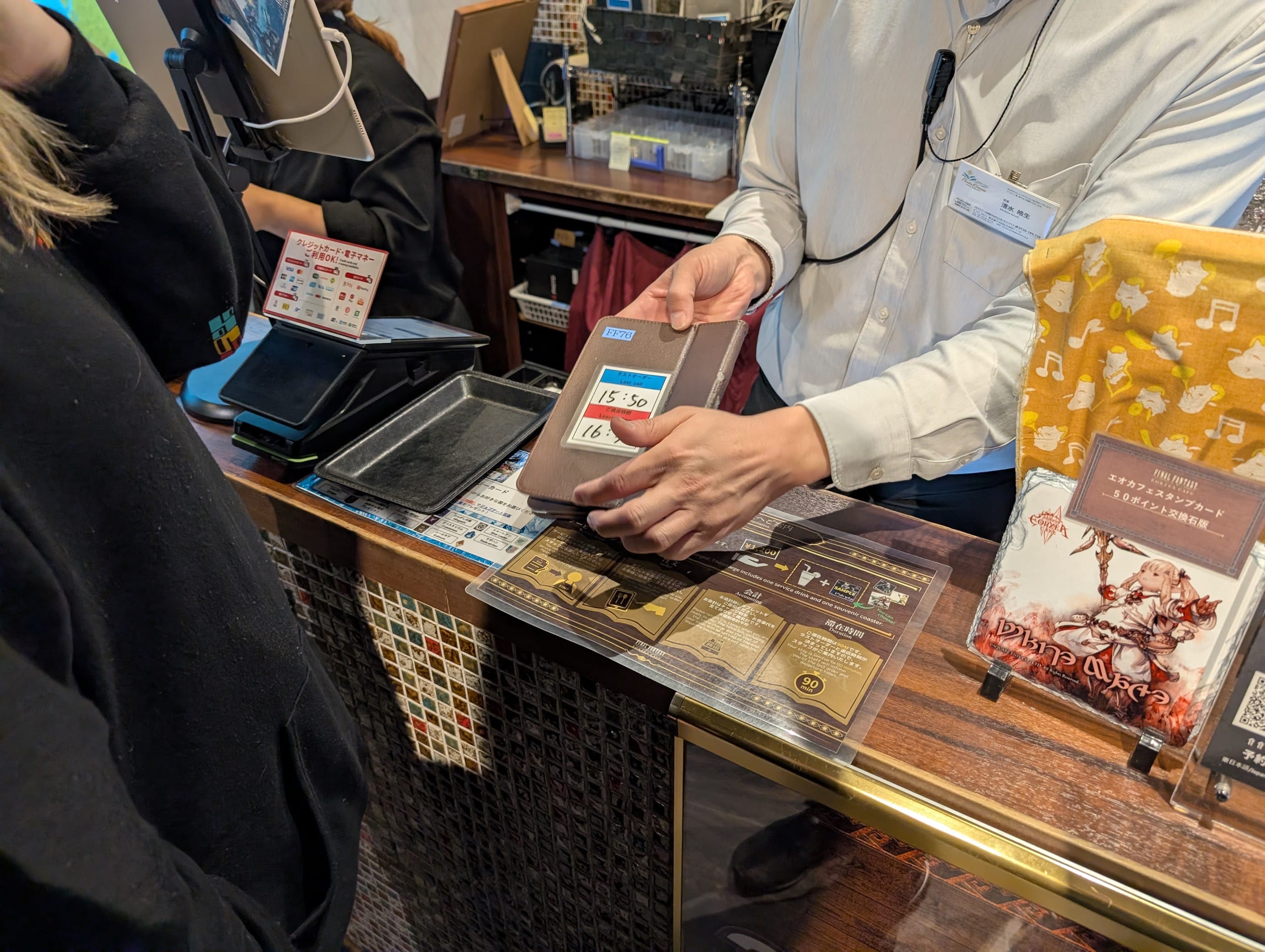 Some guy instructing us how to order on the tablet