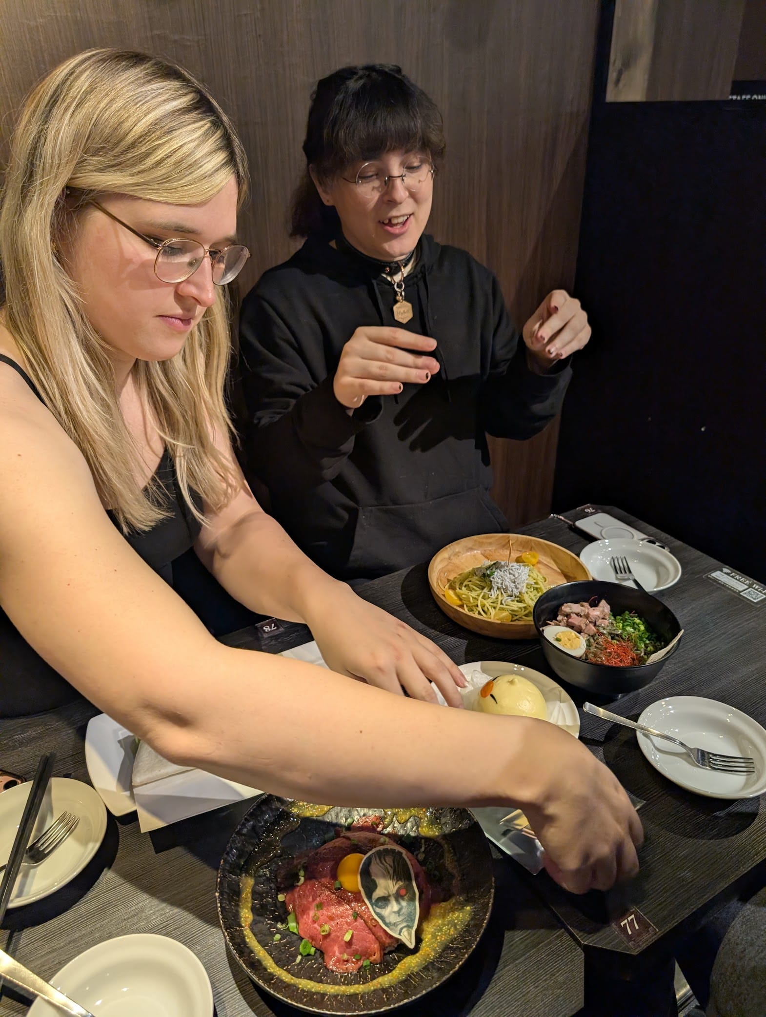 Lily and Vivi at the Final Fantasy Cafe table