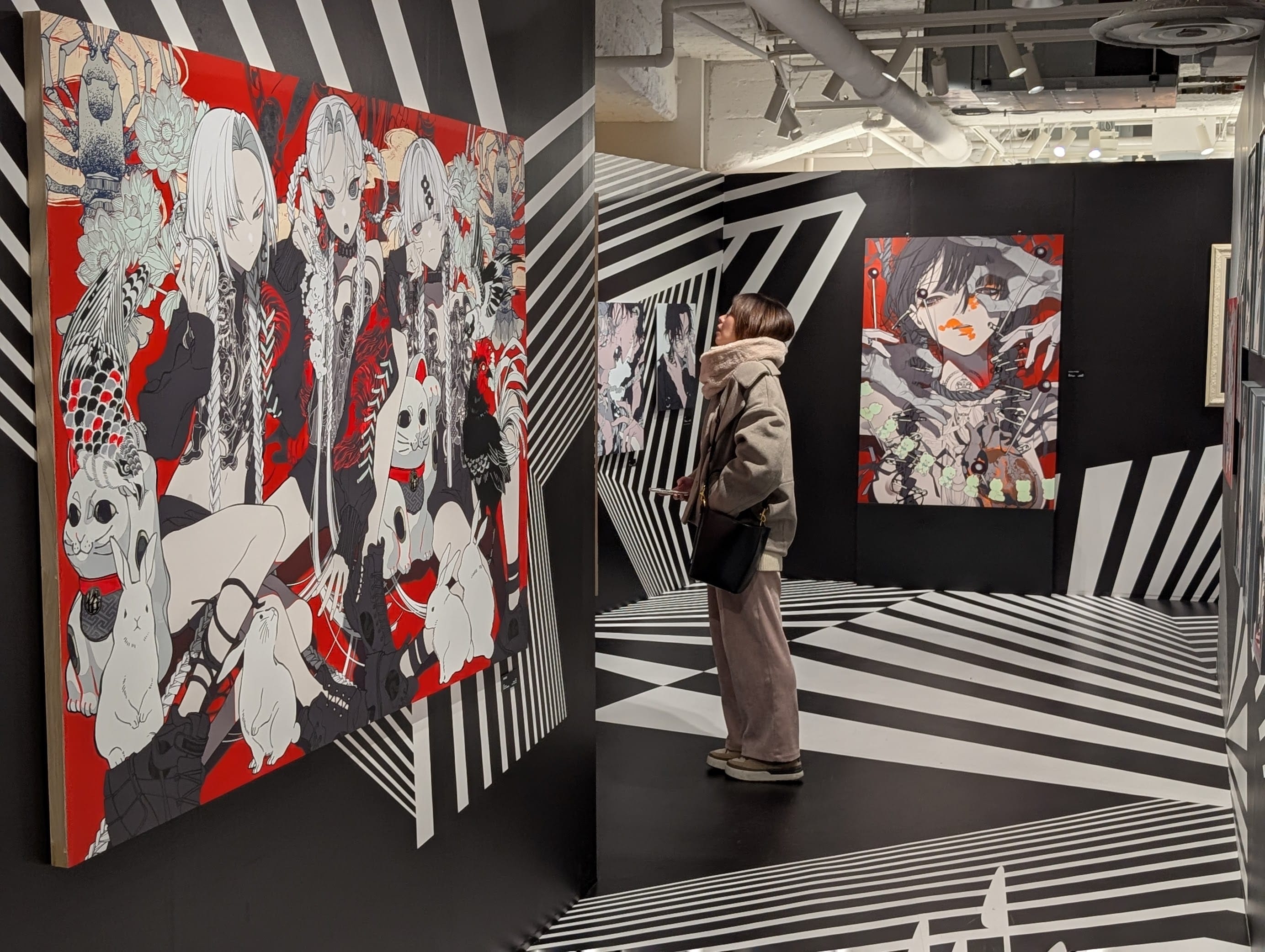 A woman in awe at the Kei Mochizuki exhibition