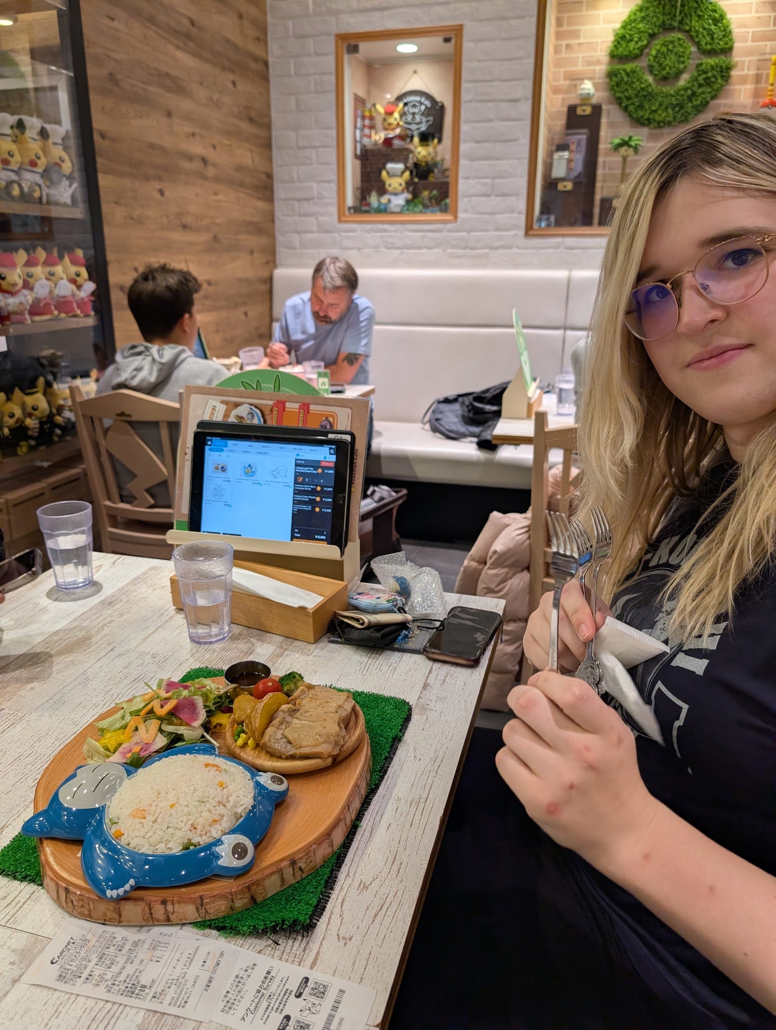 Vivi ready to eat a Snorlax meal at the Pokemon Cafe