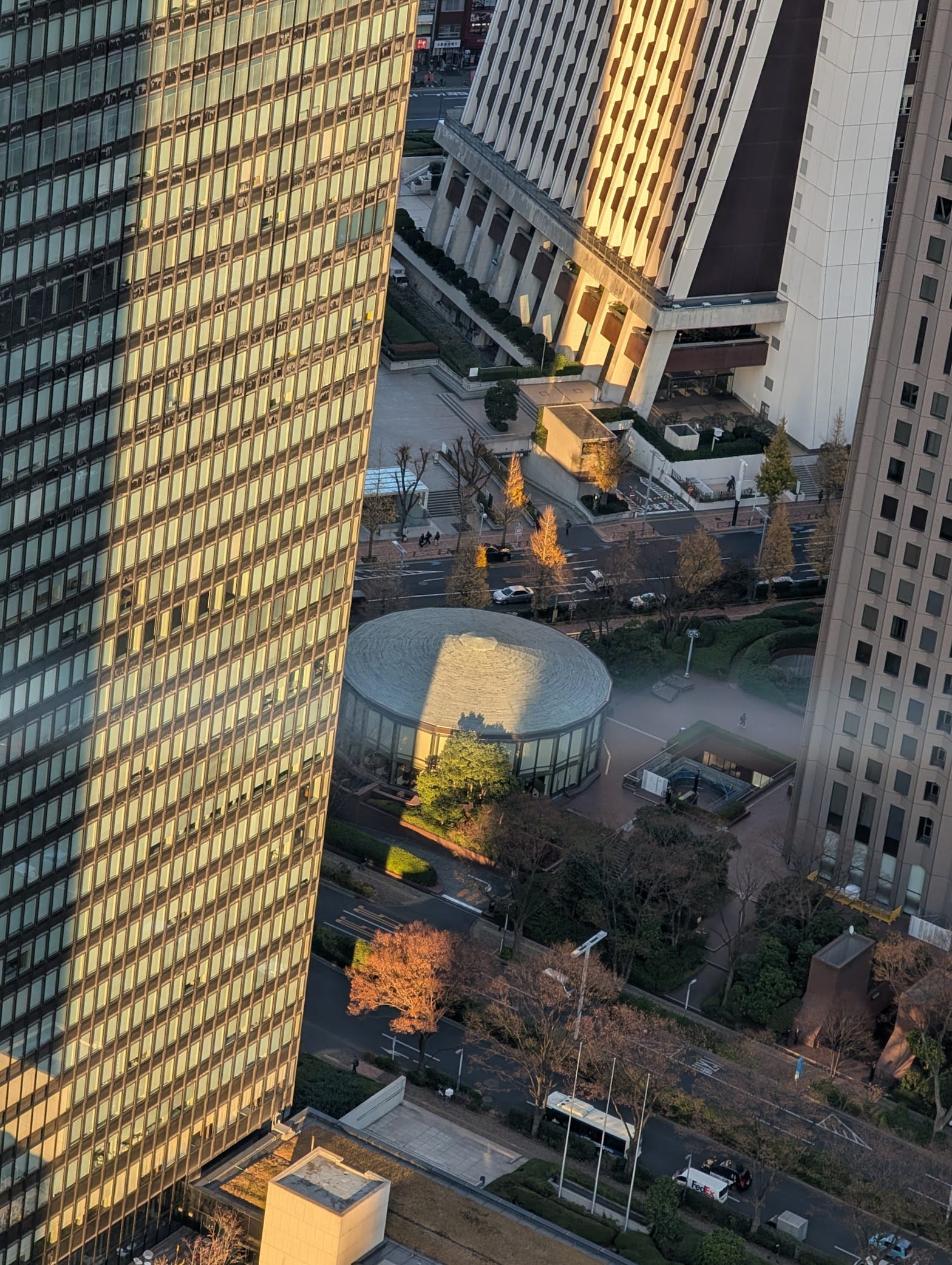 A beem of light cast across a building and the ground