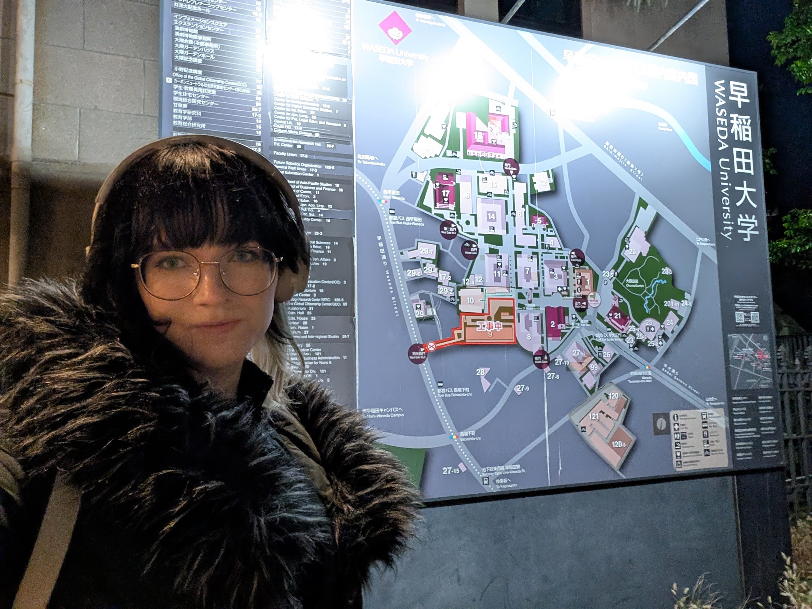 Val in front of a map of Waseda campus