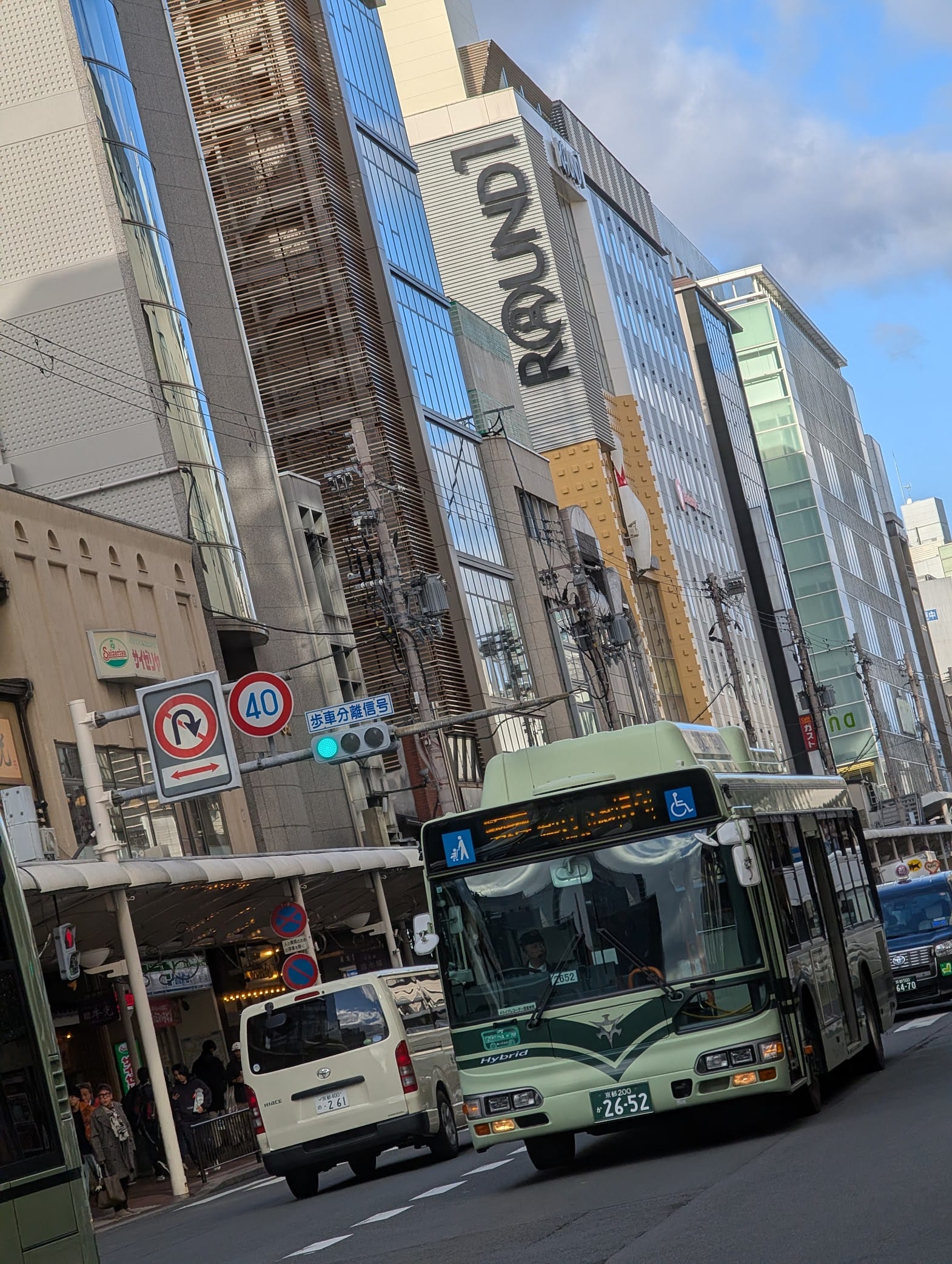 A bus with a Round1 sign in the background