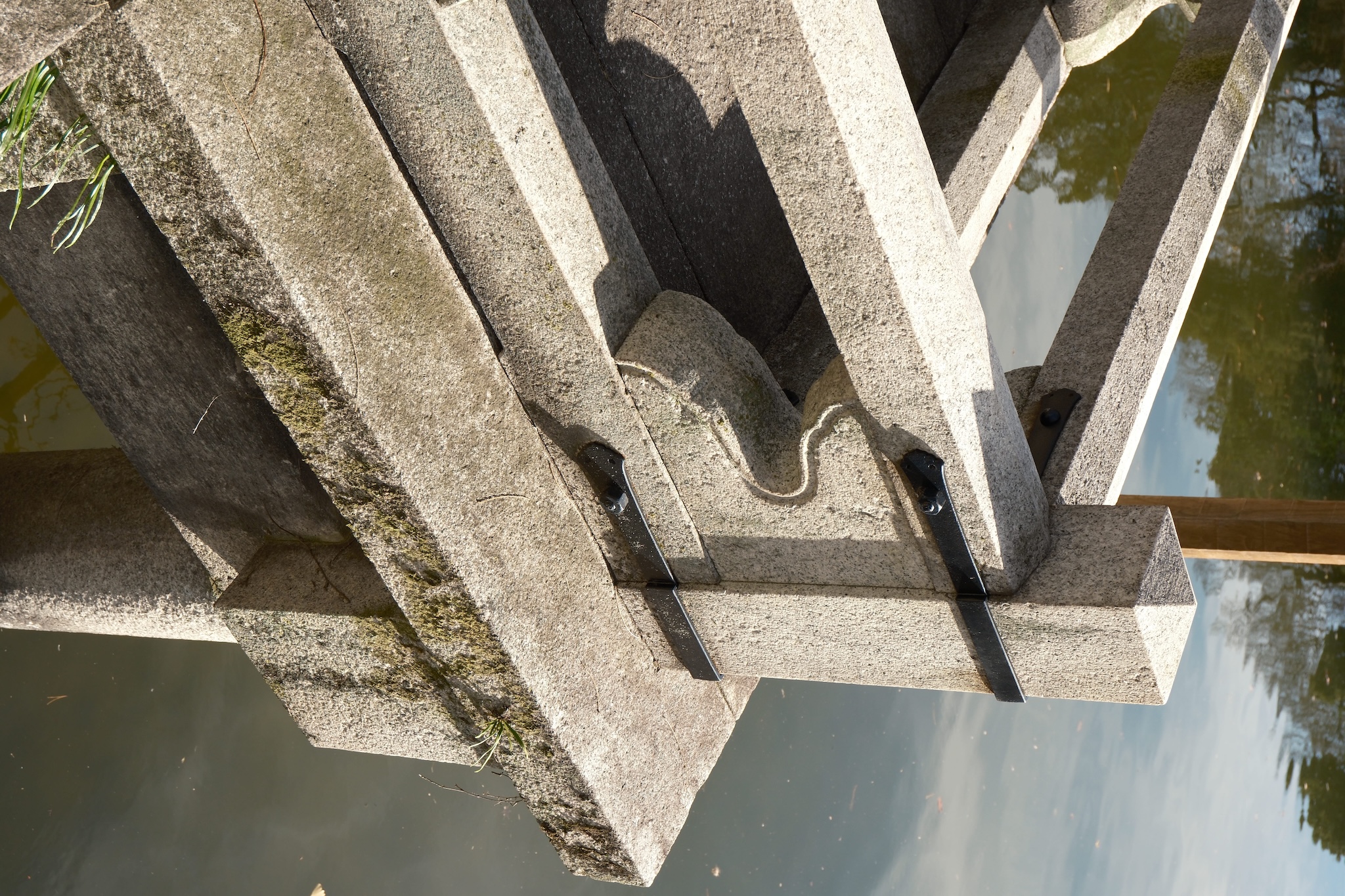The corner of a stone bridge taken from an isometric angle
