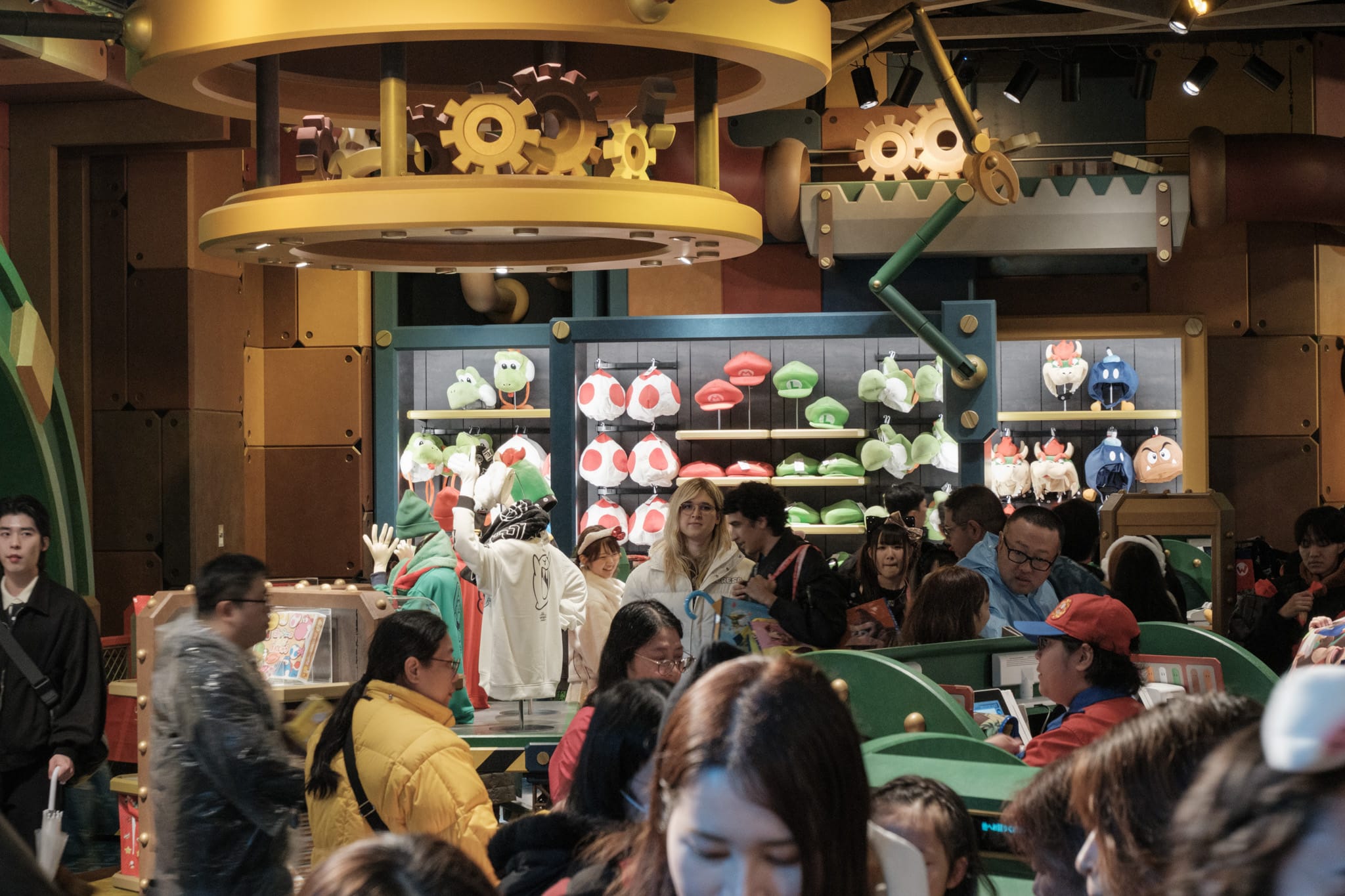 Vivi standing on the other side of the gift shop staring at the camera