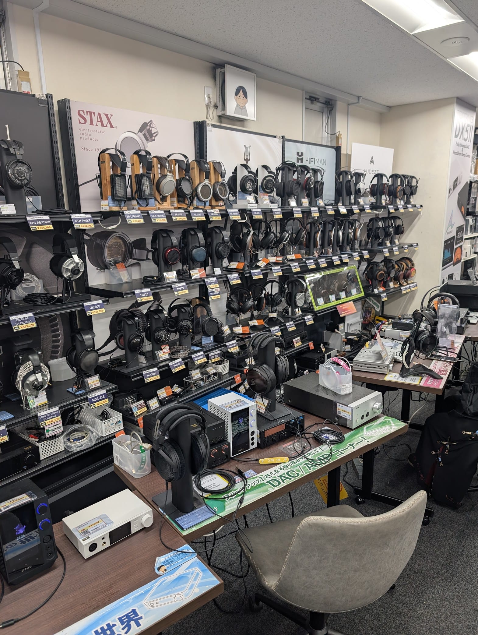 A bunch of really expensive headphones on display